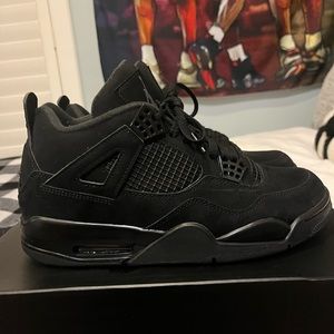 Black cat Jordan 4s